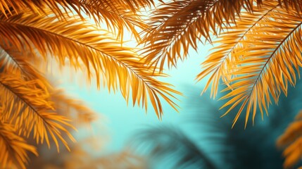 Golden palm fronds against a vibrant blue sky.