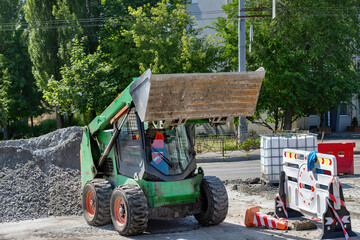 Heavy machinery in action at a construction site during midday