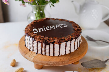 Snickers cake with caramel, peanuts and buttercream.