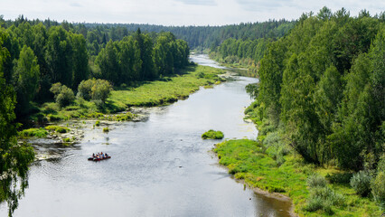 Rafting on Chusovaya river against background of coniferous trees and greenery on sunny summer day, Ural, Sverdlovsk region, Russia