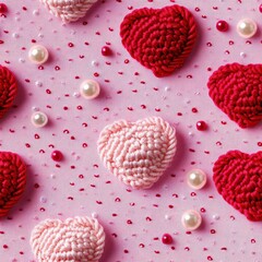 Fototapeta premium Beautiful Arrangement of Crocheted Hearts in Vivid Shades of Pink and Red on a Soft Pink Background with Decorative Pearls