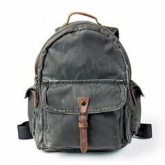 Fototapeta premium Stylish grey canvas backpack with brown leather details, showcasing a vintage or retro aesthetic, perfect for everyday use