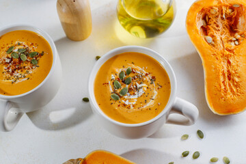 Traditional autumn butternut squash soup with seeds.
