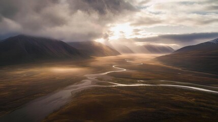 Golden Hour River:  A breathtaking aerial shot of a winding river carving through a majestic valley, bathed in the warm glow of the setting sun.  The clouds are heavy with anticipation.