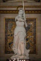 Paris, France - 12 18 2024: View detail of Joan of Arc statue inside Madeleine church.