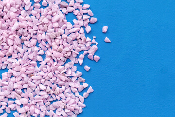 decorative pebble mock-up for design on blue background top view