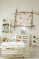 Wooden shelf with decorative elements in white minimalist interior