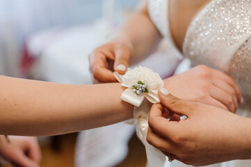 Elegant Wedding Corsage Preparation During Bridal Ceremony
