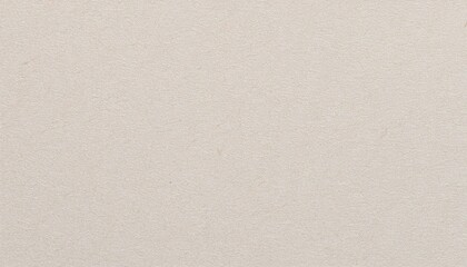 macro view of ivory-colored cardstock with smooth surface and subtle glossy finish

