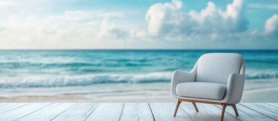 Cozy fabric sofa on a weathered wooden floor overlooking a serene ocean view with blurred summer beach backdrop for relaxation and tranquility.