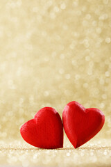 Fototapeta premium wooden hearts on bokeh background
