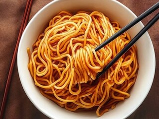 A Bowl of Delicious Noodles with Chopsticks Capturing the Essence of Asian Cuisine and Culture in a Close-Up Presentation with Warm Underlying Tones