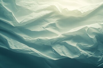 Crumpled soft fabric with subtle gradients of light and shadow creating a serene and minimalist composition