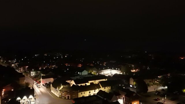 Aerial drone shot of a plane landing at night in Stansted Airport, England