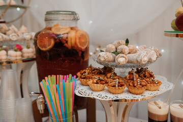 Exquisite Dessert Table Display Featuring Colorful Treats and Refreshing Beverages