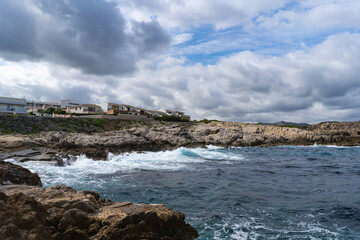 Cala Agulla, Mallorca, Spain, October 27, 2021 - Modern coastal villas overlooking Mediterranean rocky shore