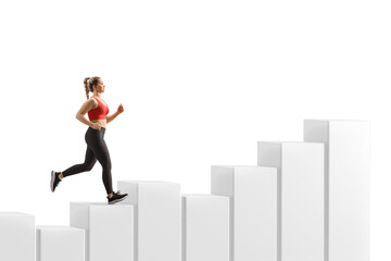 Fototapeta premium Full length profile shot of a young woman running on rising columns