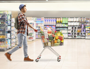 Male student with food in a shopping cart