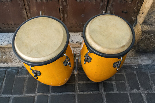 Big yellow bongos set on a street