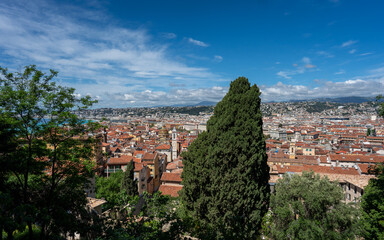 Nice, Provence-Alpes-Cote d'Azur, France - May 3, 2024: Panoramic View of Nice with Terra Cotta Rooftops and Mountains