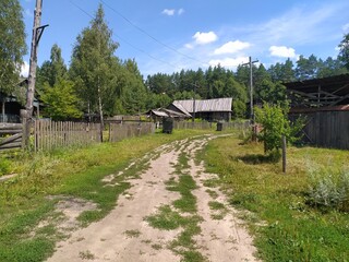 Old wooden house in the village. Russian village in the summer.