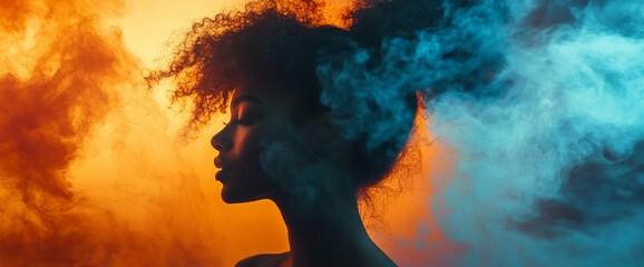 Profile silhouette of a person with curly hair against colorful smoke background.