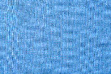 Light blue fabric as a background macro photo. Blue background