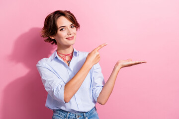 Photo of stunning nice person indicate finger hand hold empty space offer isolated on pink color...