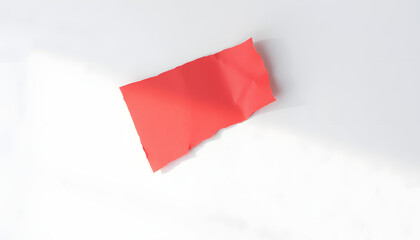 piece of red cardboard paper tear isolated on white background, dreamy atmosphere. isolated with white shades