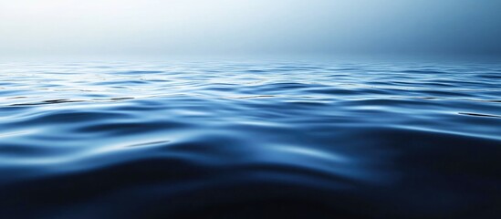 Naklejka premium Calm Ocean Surface with Gentle Waves Ideal for Business or Professional Context and Empty Space for Text or Branding