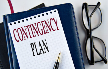 CONTINGENCY PLAN - words on white sheet on light background with notebook and cactus