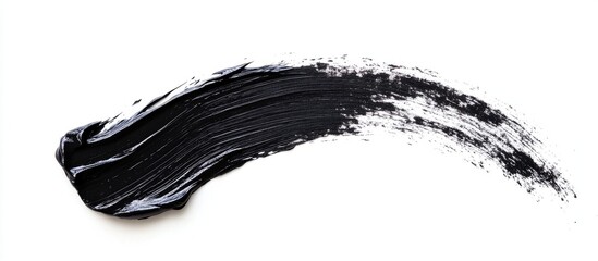 Black mascara stroke beauty product smudge on white background ideal for cosmetic advertising with space for text and branding opportunities