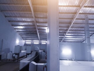 Industrial machine building with a boundary wall.