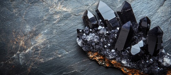 Polished Black Crystals on Dark Stone Background with Empty Copyspace for Text and Display Purposes