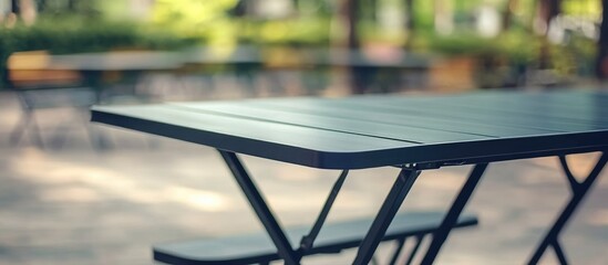 Versatile Black Folding Table with Steel Frame Ideal for Indoor Outdoor Use Perfect for Events Conferences and Temporary Setup with Copyspace