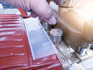 Check the grease lubricating cup on the water pump piston.