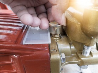 Check the grease lubricating cup on the water pump piston.