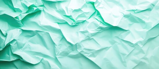 Obraz premium Exotic Mint Crumpled Paper Background Soft Blurred Texture for Minimalist Art Creative Design with Copy Space for Text or Content