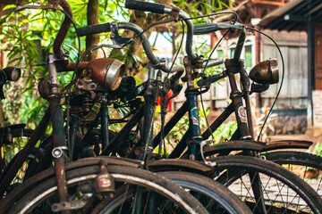 Close up of a classic bicycle full of rust and worn out. Details of old bicycle parts that are neglected and full of dust, look like they are starting to rust and become porous