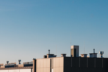 Industrial Rooftops Under a Clear Blue Sky