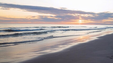 Golden sunset over a peaceful beach with gentle waves and soft sand