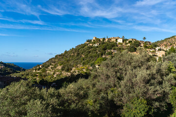 Deia, Mallorca, Spain 26.10.2021 Hillside village with Mediterranean sea view and traditional stone houses on mountain slope