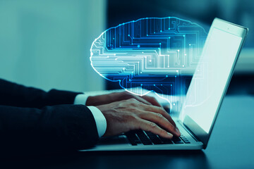 Businessman working on laptop at desk, closeup. Digital brain coming out of computer symbolizing...