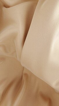 Abstract golden fabric silk background, luxury fashion wavy cloth animation. Fluid wave texture. Elegant textile material ripples. 3D minimal motion design template