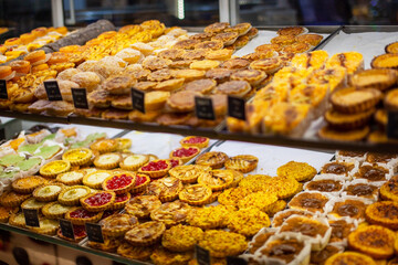 Assortment of cookies on display in a shop window 