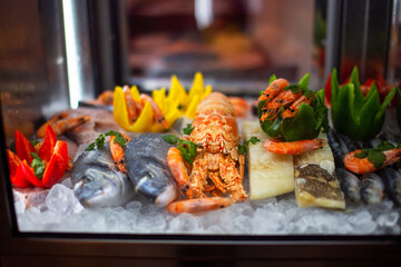 Fresh seafood on ice in a restaurant. Seafood restaurant menu.
