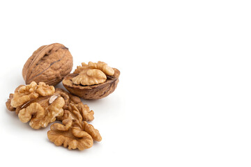 Whole and Shelled Walnuts – Versatile Nutty Ingredients Placed on Left Side of White Background with Copy Space