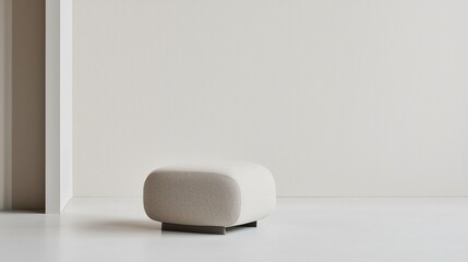 Minimalist neutral pouf in tranquil modern interior space