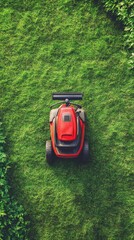 Red lawn mower cutting grass in a green garden during daytime