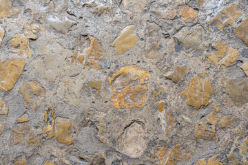 Palma de Mallorca, Spain 29.10.2021: Weathered sandstone texture detail of La Almudaina Palace wall